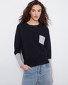 Navy sweater with long sleeves and a patch pocket, featuring a relaxed fit for ultimate comfort by Charlie B.