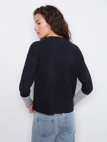 Elegant navy sweater with subtle contrast detailing, crafted in a relaxed fit for everyday style by Charlie B.