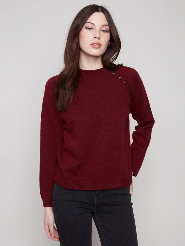 Cabernet sweater showcasing knit cuffs and a stylish design, perfect for any occasion by Charlie B.