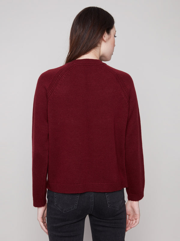 Stylish raglan sleeves enhance the comfort of this cabernet sweater, making it a wardrobe essential by Charlie B.