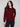 Chic cabernet sweater featuring faux leather detail at the armhole, adding a modern touch by Charlie B.