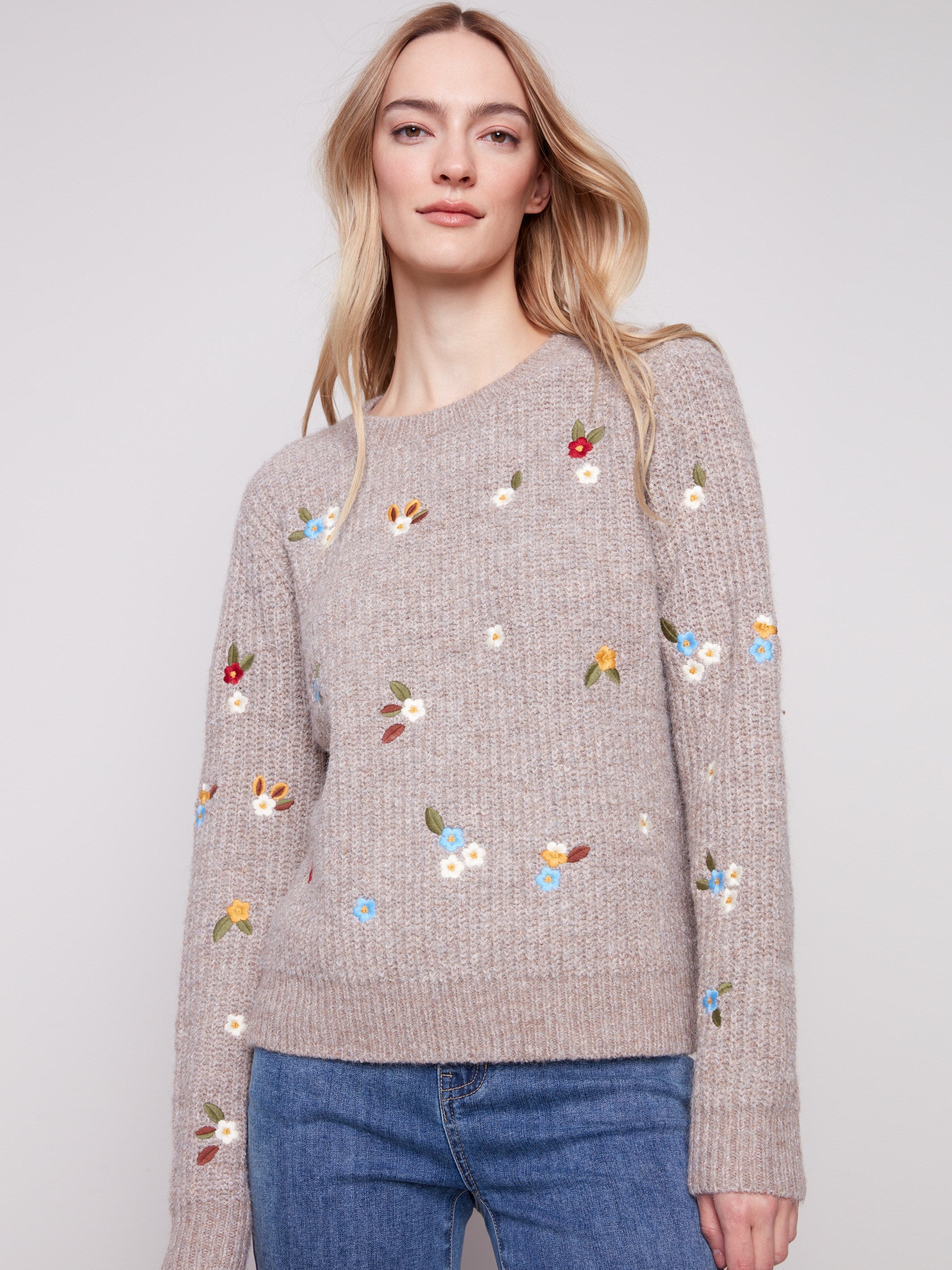 Soft light brown sweater adorned with colorful floral embroidery and elegant long sleeves by Charlie B.