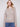 Soft light brown sweater adorned with colorful floral embroidery and elegant long sleeves by Charlie B.