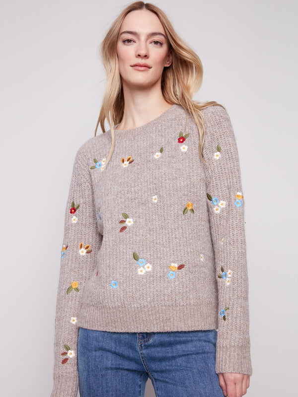 Soft light brown sweater adorned with colorful floral embroidery and elegant long sleeves by Charlie B.