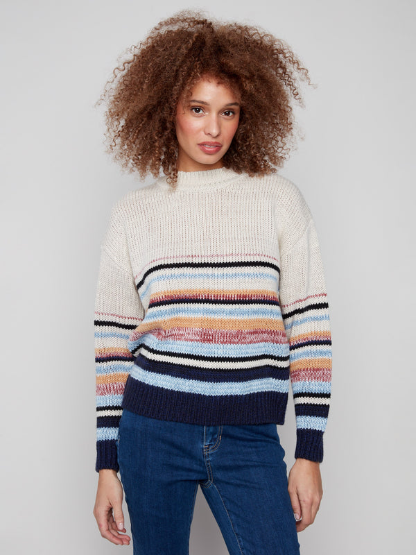 Colorful striped sweater with cozy crew neck and knit cuffs, perfect for chilly days by Charlie B.