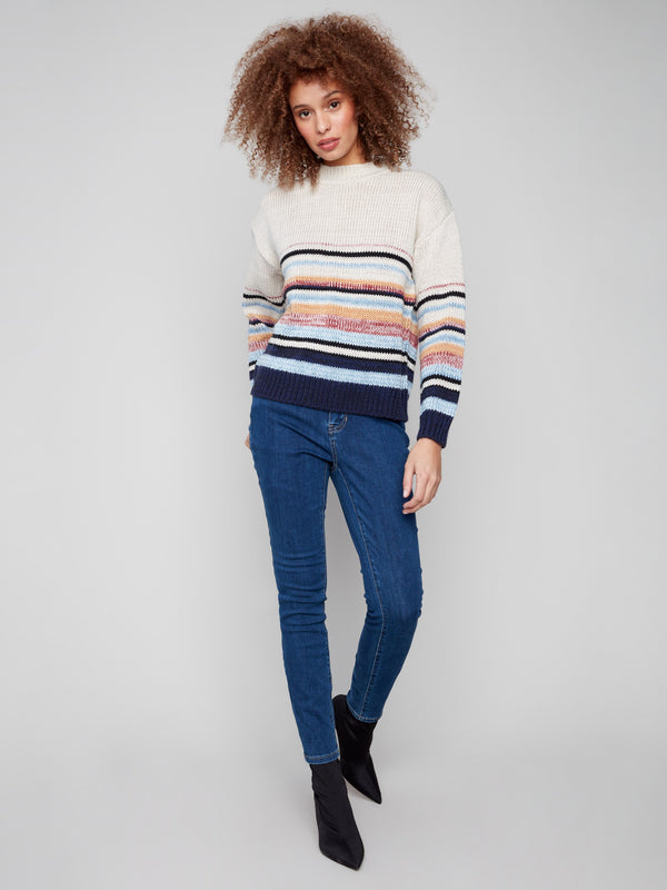 Vibrant striped sweater featuring a relaxed drop shoulder design and knit cuffs by Charlie B.