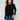 Black sweater with star stud details, showcasing its classic crew neck design. Perfect for casual outings. By Charlie B.