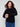 Elegant black sweater featuring raglan sleeves and stylish star studs, ideal for a chic look. Crafted by Charlie B.