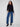 Stylish black crew neck sweater with distinctive star stud accents on the sleeves, adding flair to any outfit. By Charlie B.