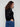 Chic black sweater adorned with sparkling star studs on the sleeves, offering a unique touch to your wardrobe. By Charlie B.