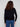 Versatile black sweater highlighted by its sleek design and eye-catching star stud details on the arms. Created by Charlie B.