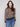 Sweater featuring a chic crew neck and bold leopard print design with striped sleeves, perfect for making a statement by Charlie B.