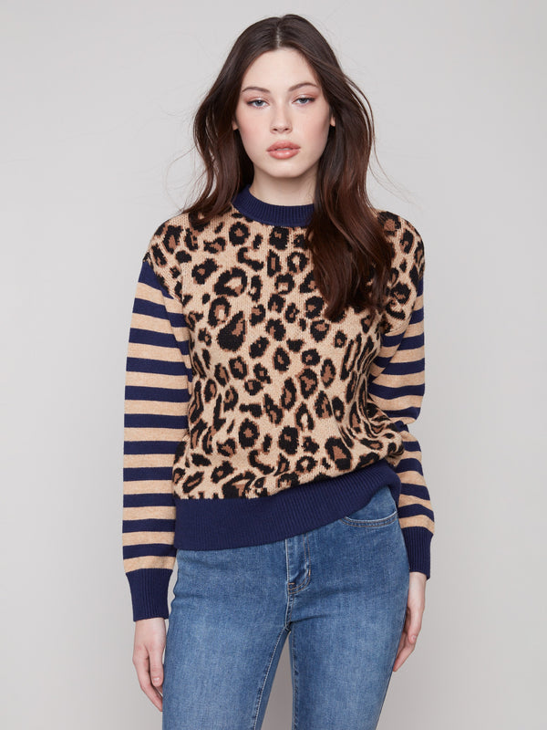 Sweater featuring a chic crew neck and bold leopard print design with striped sleeves, perfect for making a statement by Charlie B.