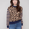 Sweater featuring a chic crew neck and bold leopard print design with striped sleeves, perfect for making a statement by Charlie B.