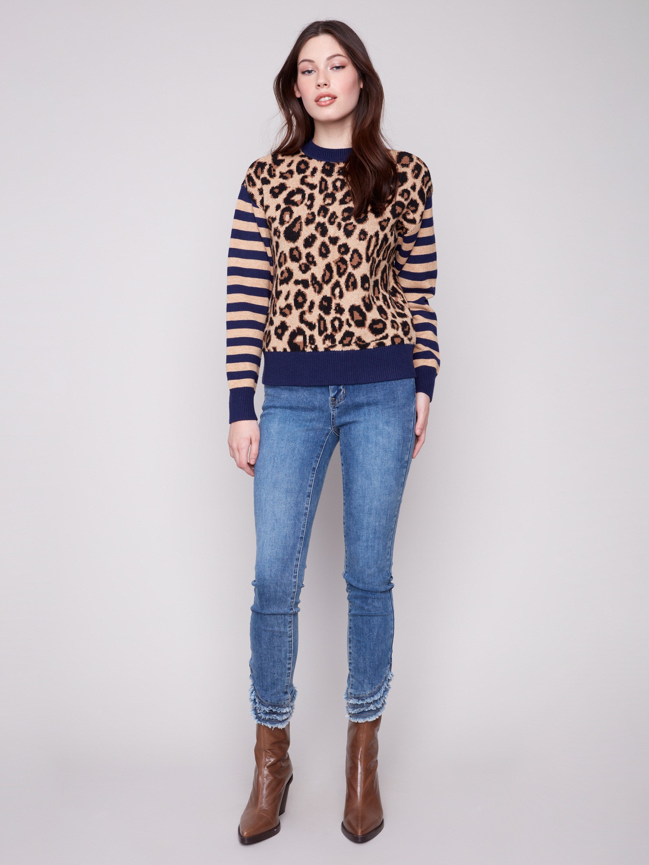 Stylish drop shoulder sweater in leopard print with contrasting striped sleeves, ideal for a trendy casual look by Charlie B.