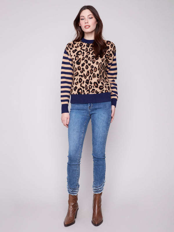 Stylish drop shoulder sweater in leopard print with contrasting striped sleeves, ideal for a trendy casual look by Charlie B.