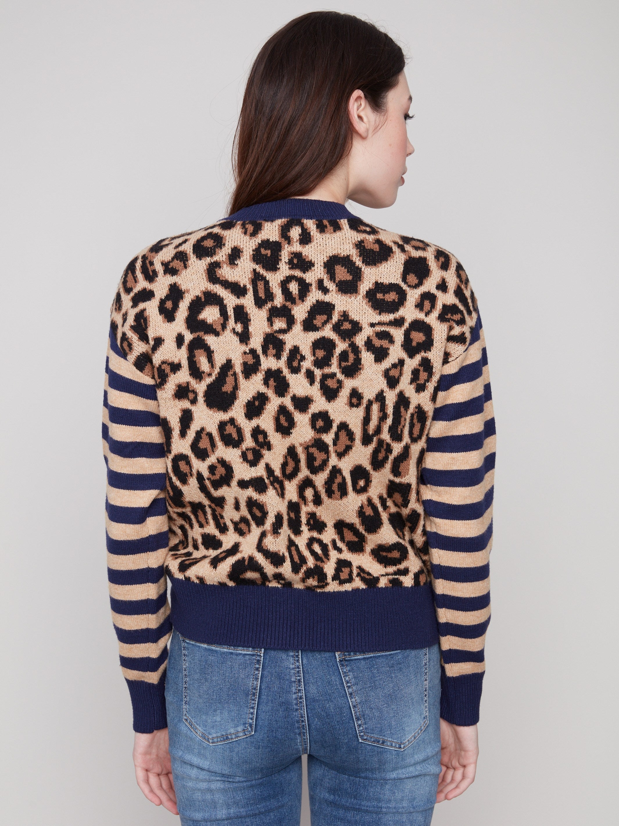 Leopard jacquard body sweater with complementary striped sleeves and ribbed cuffs adds flair to any outfit by Charlie B.