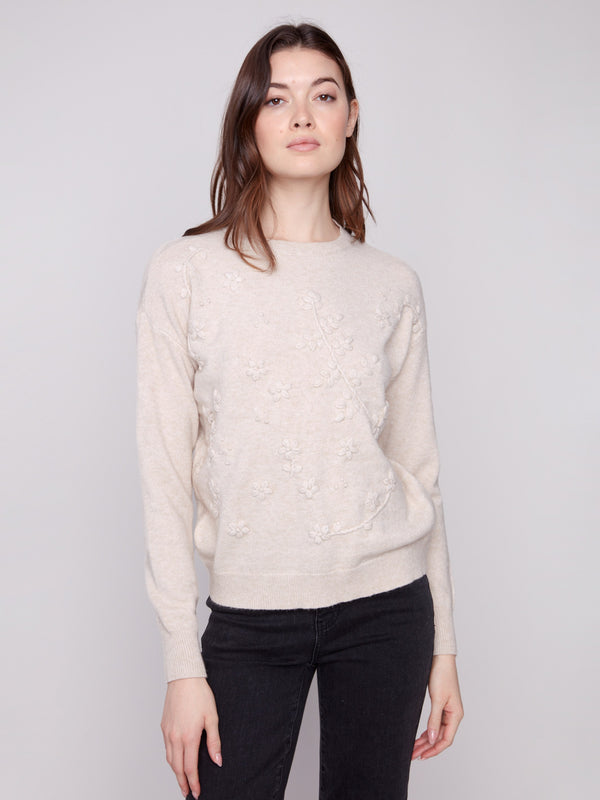 Heather oat sweater featuring a classic crew neckline and knit cuffs, offering timeless style by Charlie B.