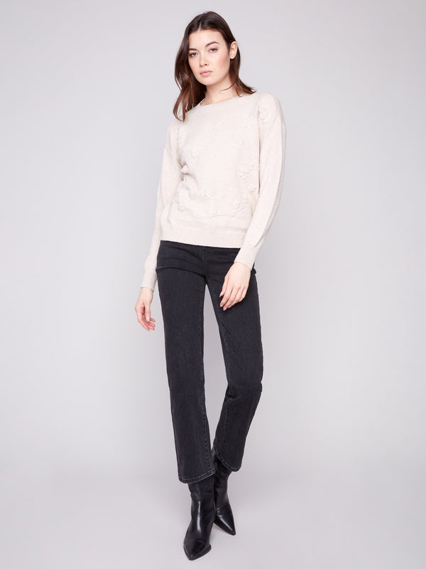 Elegant sweater with a drop shoulder design, enhancing its relaxed fit and comfort by Charlie B.