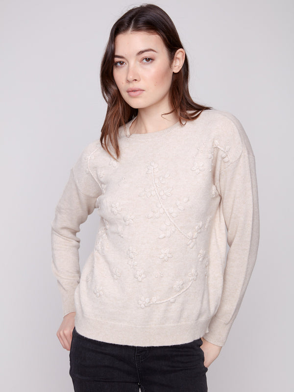 Chic drop shoulders on this heather oat sweater provide a modern and relaxed silhouette by Charlie B.
