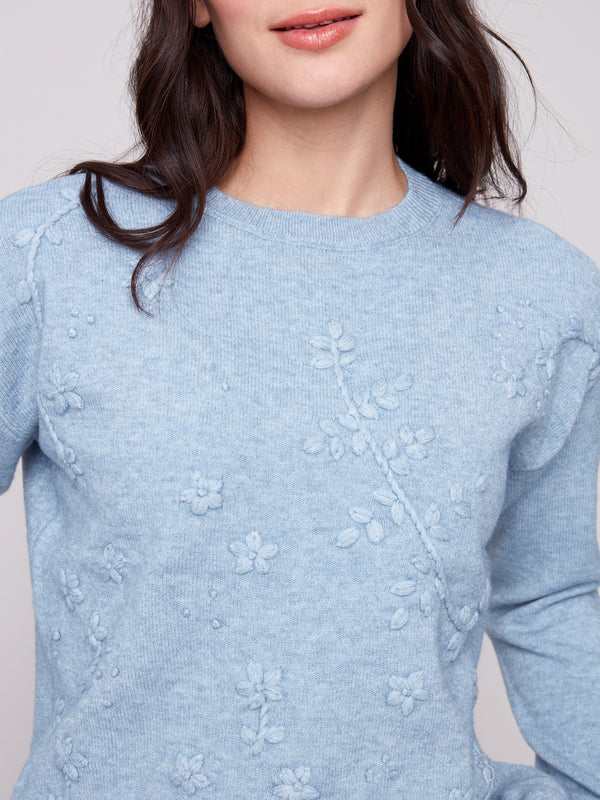 Soft oxford sweater showcasing intricate tonal embroidery and a refined crew neck design by Charlie B.