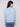 Heather oxford sweater highlighted by its drop shoulder style and subtle floral patterns by Charlie B.