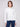 White sweater with a crew neck and speckled pattern, featuring a drop shoulder design by Charlie B.
