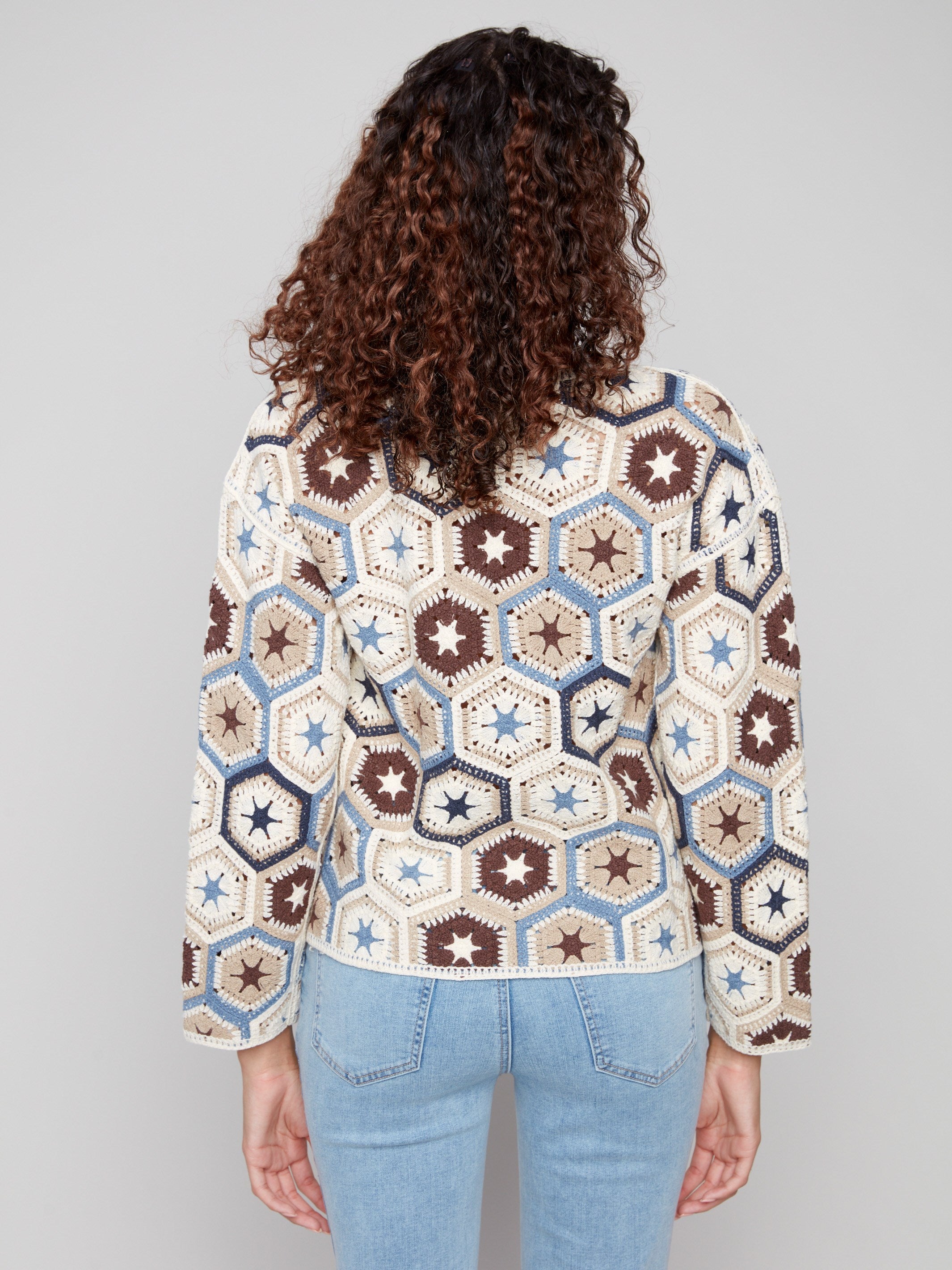 Stylish crochet top with a unique hexagonal pattern, perfect for adding flair to any outfit by Charlie B.