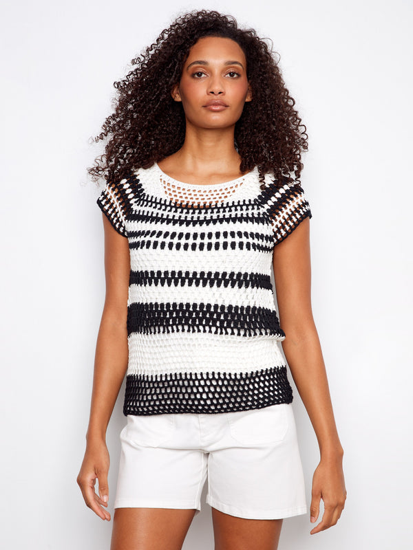 Chic black and white striped top featuring a boat neckline, perfect for casual outings. Elevate your style effortlessly by Charlie B.