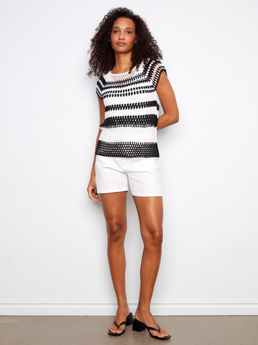Embrace timeless elegance with this black and white striped top, designed with a flattering boat neckline by Charlie B.