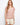 Featuring a stylish boat neckline, this top showcases a chic design in pink-toned stripes, perfect for any casual outing. By Charlie B.