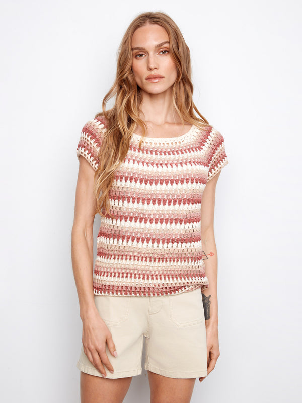 Featuring a stylish boat neckline, this top showcases a chic design in pink-toned stripes, perfect for any casual outing. By Charlie B.