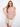 This top comes with raglan cap sleeves, adding a touch of elegance to the pink-toned striped pattern. Ideal for warm weather. By Charlie B.