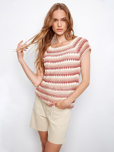 This top comes with raglan cap sleeves, adding a touch of elegance to the pink-toned striped pattern. Ideal for warm weather. By Charlie B.