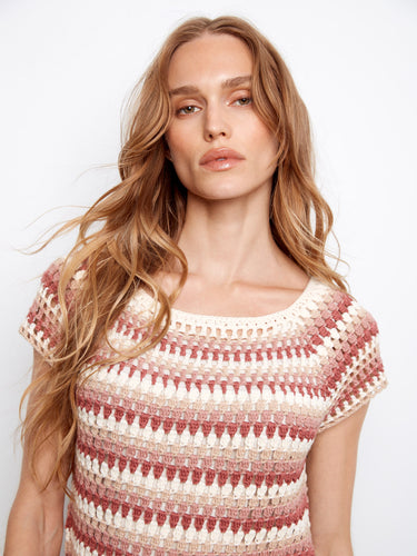 The combination of pink-toned stripes adds vibrant charm to this comfortable and versatile top, suitable for various occasions. By Charlie B.