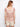 Crafted from soft materials, this piece offers comfort and style with its eye-catching pink-toned stripe pattern throughout. By Charlie B.