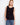 Elegant sleeveless top featuring a crochet design with button-up front, perfect for layering in style by Charlie B.