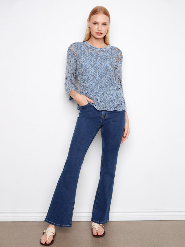 Stylish blue haze crochet sweater showcasing three-quarter sleeves, ideal for any casual outing by Charlie B.