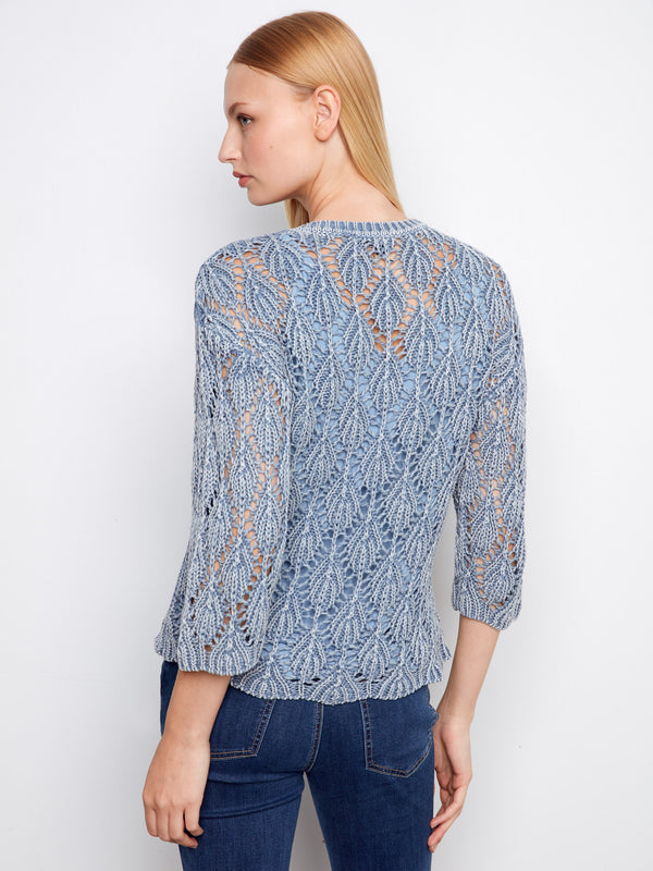 Beautifully crafted crochet sweater in blue haze with crew neck design, offering timeless elegance by Charlie B.