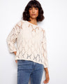 Elegant cotton blend sweater with a relaxed fit, perfect for casual outings. Designed by Charlie B.