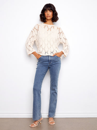 Stylish 3/4 sleeve sweater crafted from a soft cotton blend for ultimate comfort. By Charlie B.