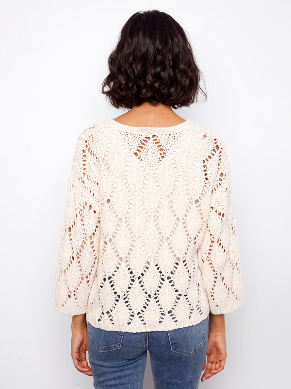 Classic sweater featuring 3/4 sleeves and a cozy feel, perfect for any season. Designed by Charlie B.