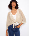 Beige crochet shrug with elbow dolman sleeves and a subtle metallic effect, perfect for layering by Charlie B.