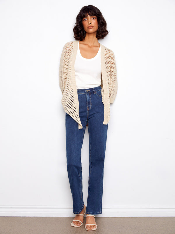 Stylish beige shrug with elbow-length dolman sleeves, designed for comfort and elegance by Charlie B.