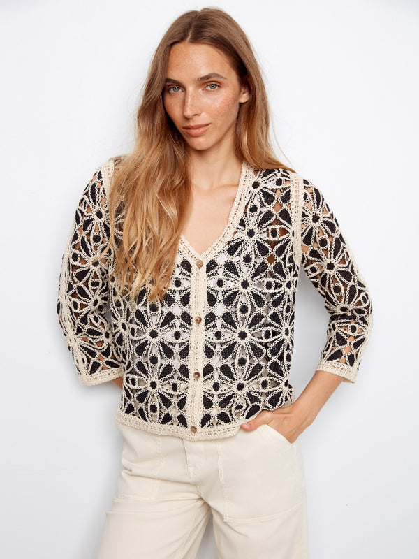 Crochet cardigan with intricate floral pattern and V-neck design, perfect for adding elegance to any outfit by Charlie B.