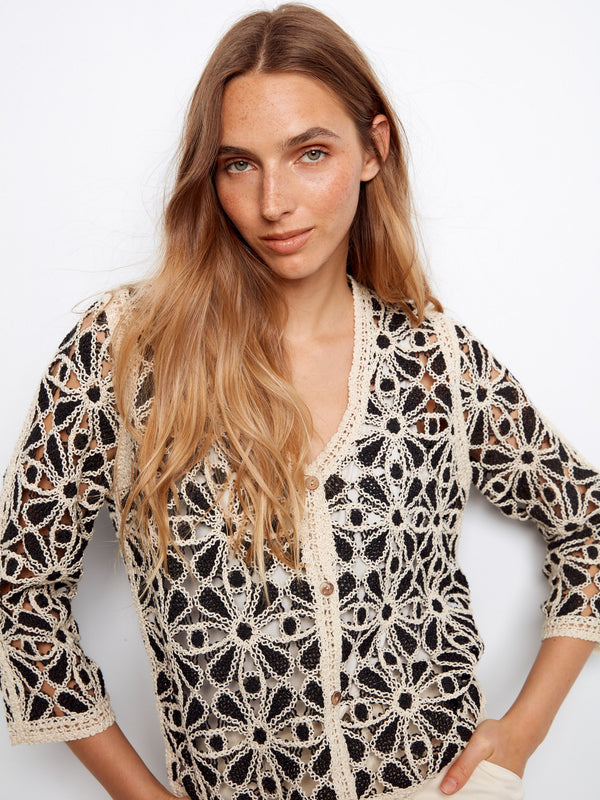 Beautifully crafted crochet cardigan with 3/4 sleeves, offering a chic touch to your wardrobe essentials by Charlie B.