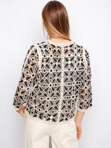Charming crochet cardigan with exquisite detailing and classic silhouette, perfect for elevating everyday style by Charlie B.