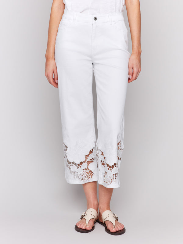 Cropped white jeans featuring stretch denim material by Charlie B.