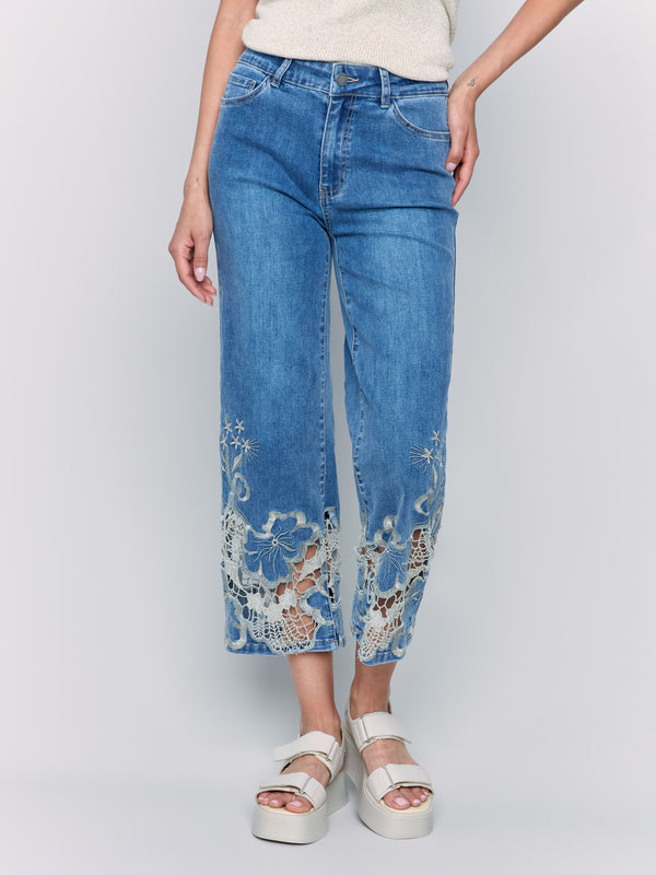 Classic five-pocket design on cropped medium blue flare leg jeans by Charlie B.