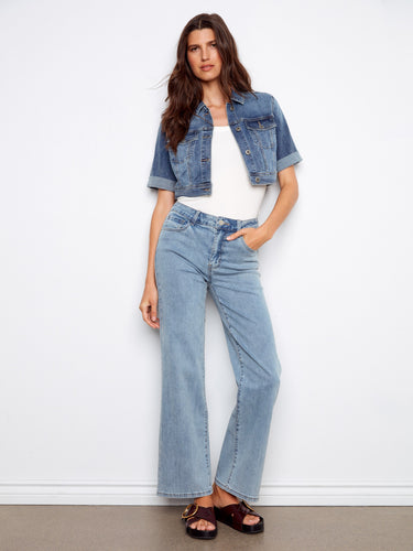 Denim jacket with a stylish button closure, perfect for a casual day out. Features rolled sleeves for added flair by Charlie B.
